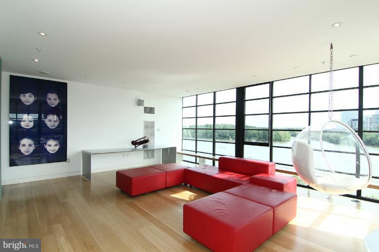 3303 Water Street Northwest, Unit 7AN Washington, DC 20007 - Photo 10 of 30 a living room with furniture and a large window