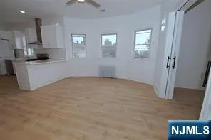 a view of a kitchen with electric appliances