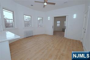 63 Van Winkle Avenue, Unit 2 Garfield, NJ 07026 - Photo 8 of 15 an empty room with windows