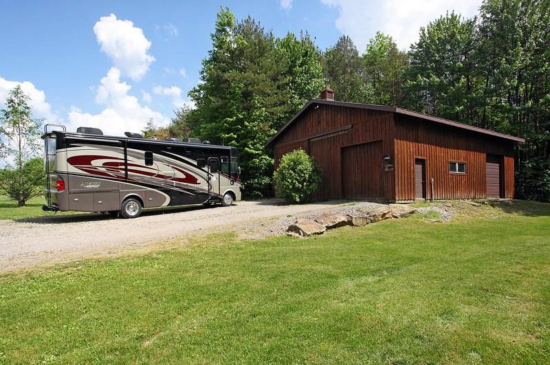 479 McCleary Road Knox, PA 16232 - Photo 22 of 24 Detached large Equipment Barn. Big enough for an RV and/or 8 cars. Has a 13.6x12 door for RV. Metal Roof and Pine wood.