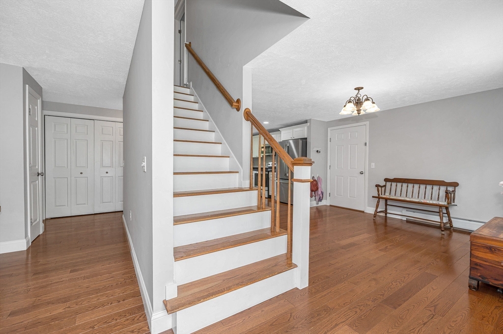 43 West Main Street Orange, MA 01364 - Photo 13 of 32 a view of entryway with wooden floor and stairs