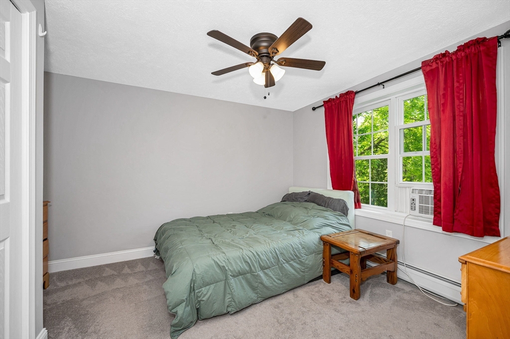 43 West Main Street Orange, MA 01364 - Photo 14 of 32 a bedroom with a bed and window
