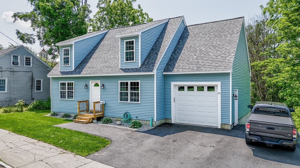 43 West Main Street Orange, MA 01364 - Photo 24 of 32 a front view of a house with a garden