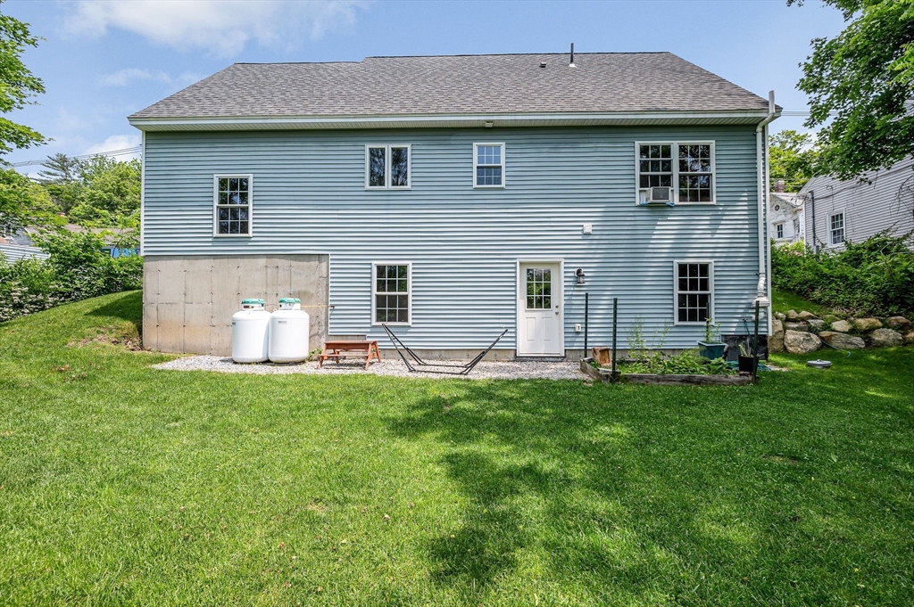 43 West Main Street Orange, MA 01364 - Photo 28 of 32 a front view of a house with a yard