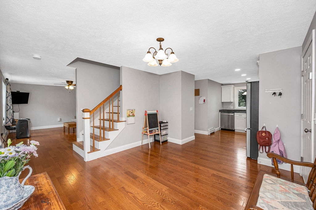43 West Main Street Orange, MA 01364 - Photo 3 of 32 a living room with furniture and wooden floor