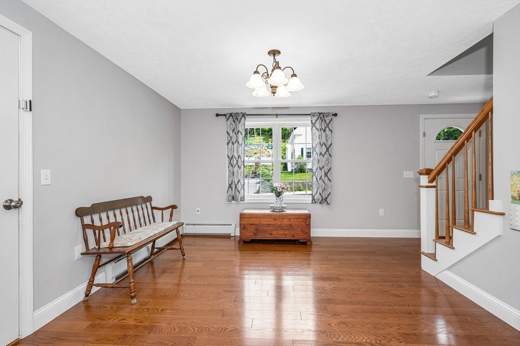 43 West Main Street Orange, MA 01364 - Photo 4 of 32 a living room with furniture and a large window