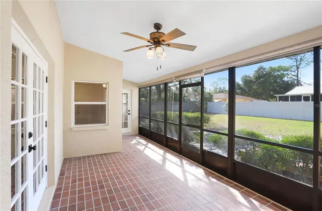 a backyard of a house with table and chairs
