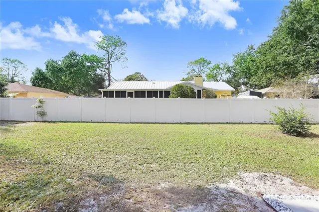 a view of a swimming pool with a yard