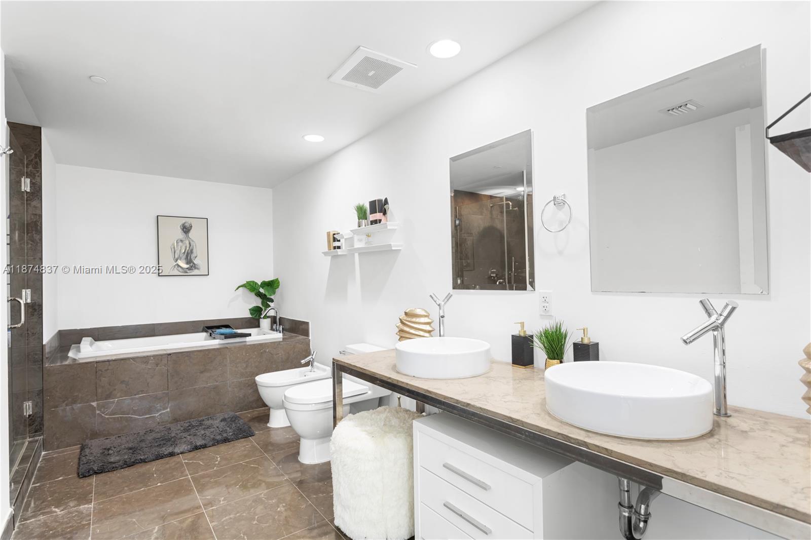 465 Brickell Avenue, Unit 2702 Miami, FL 33131 - Photo 15 of 22 a bathroom with a sink double vanity and a mirror