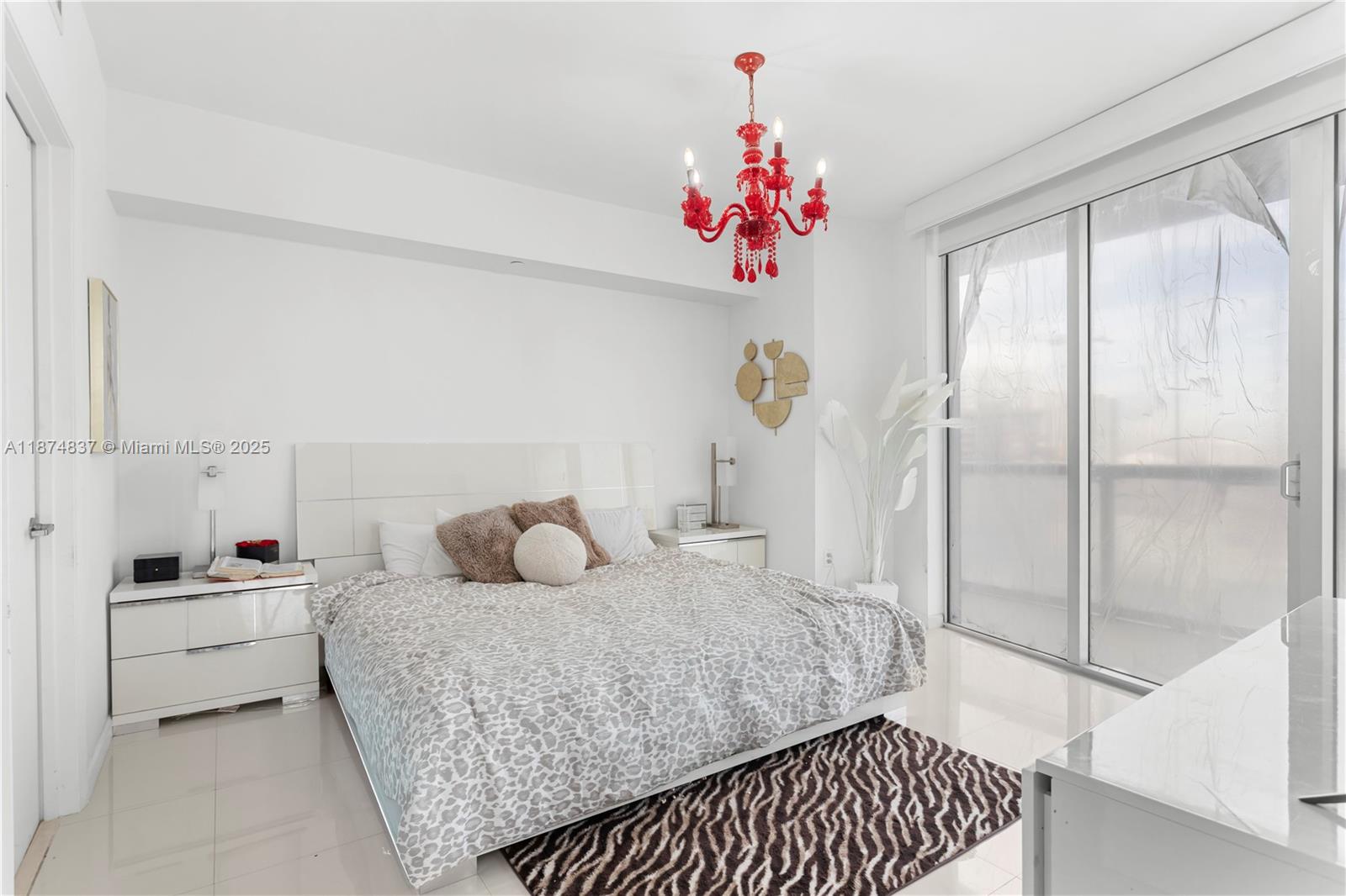 465 Brickell Avenue, Unit 2702 Miami, FL 33131 - Photo 16 of 22 a bedroom with a bed and a window with painted walls