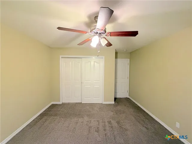 a view of a chandelier fan in a room