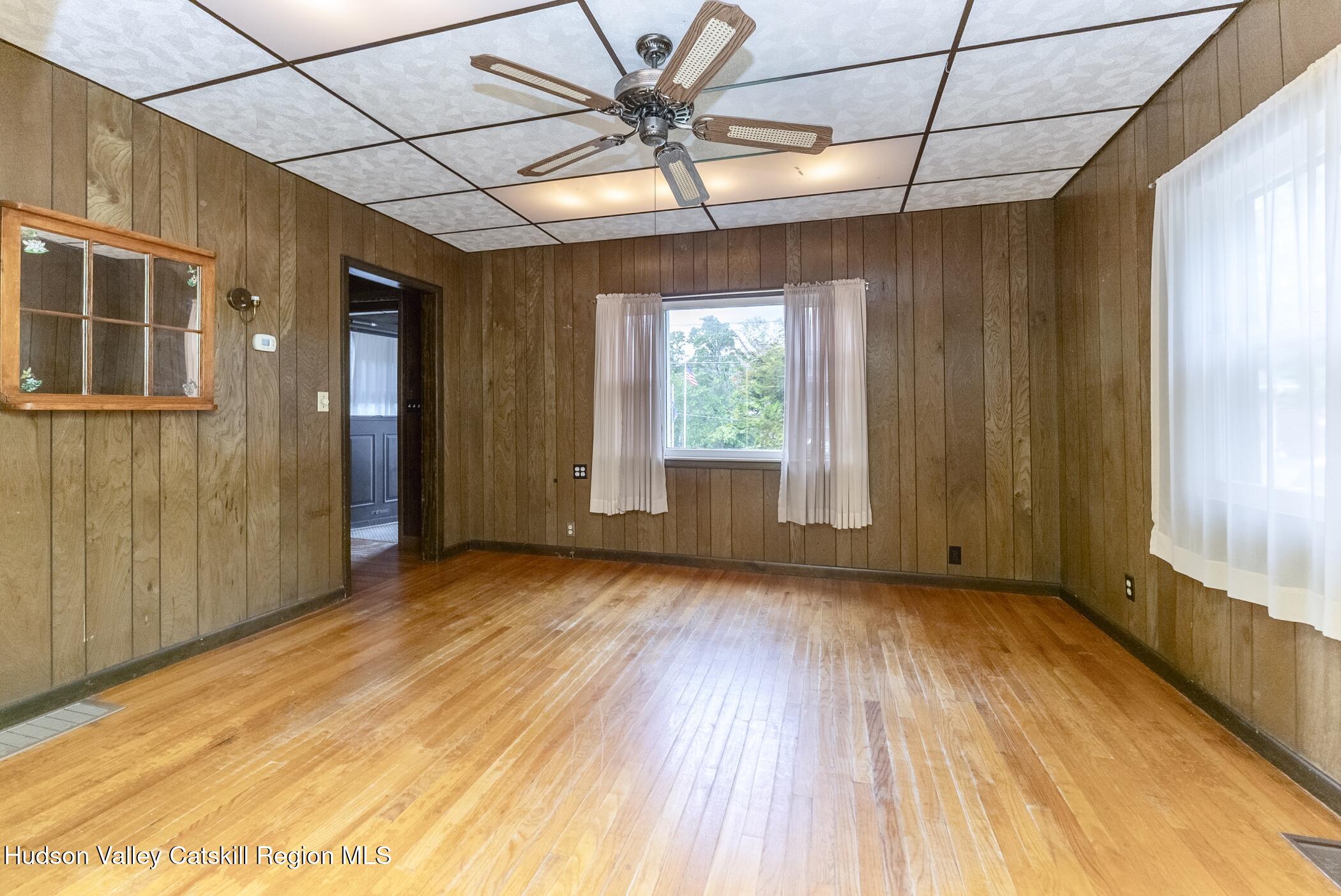 23 Maple Street Rifton, NY 12471 - Photo 12 of 43 a view of an empty room with a window and wooden floor