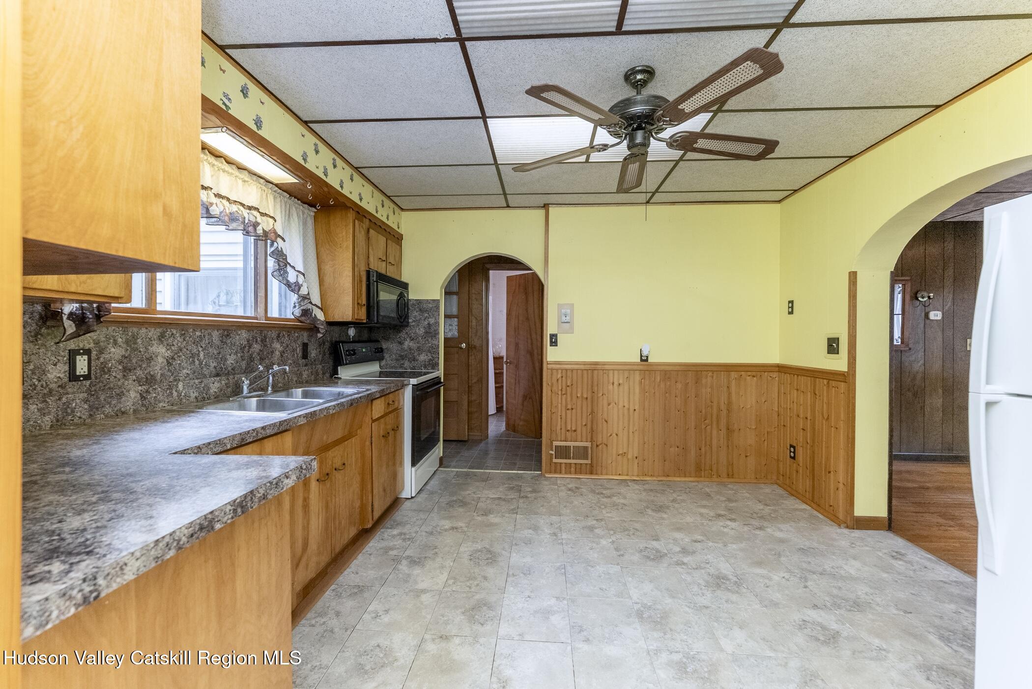 23 Maple Street Rifton, NY 12471 - Photo 16 of 43 a kitchen with stainless steel appliances granite countertop a sink and cabinets