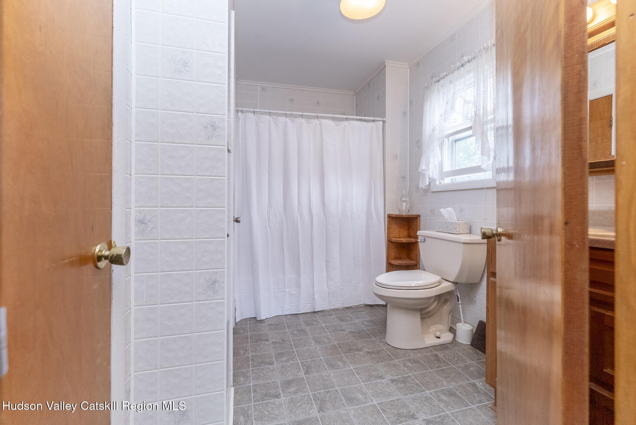 23 Maple Street Rifton, NY 12471 - Photo 22 of 43 a bathroom with a toilet and a shower