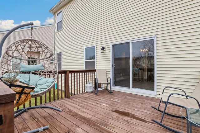 a view of a wooden deck with a barbeque
