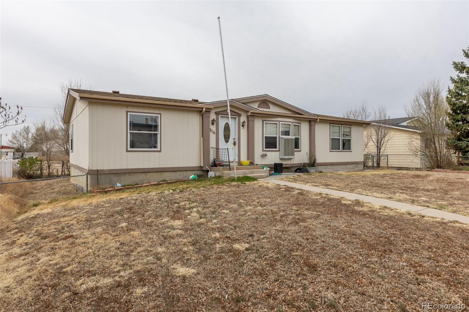 114 6th Street Hugo, CO 80821 - Photo 1 of 50 a view of a house with a yard