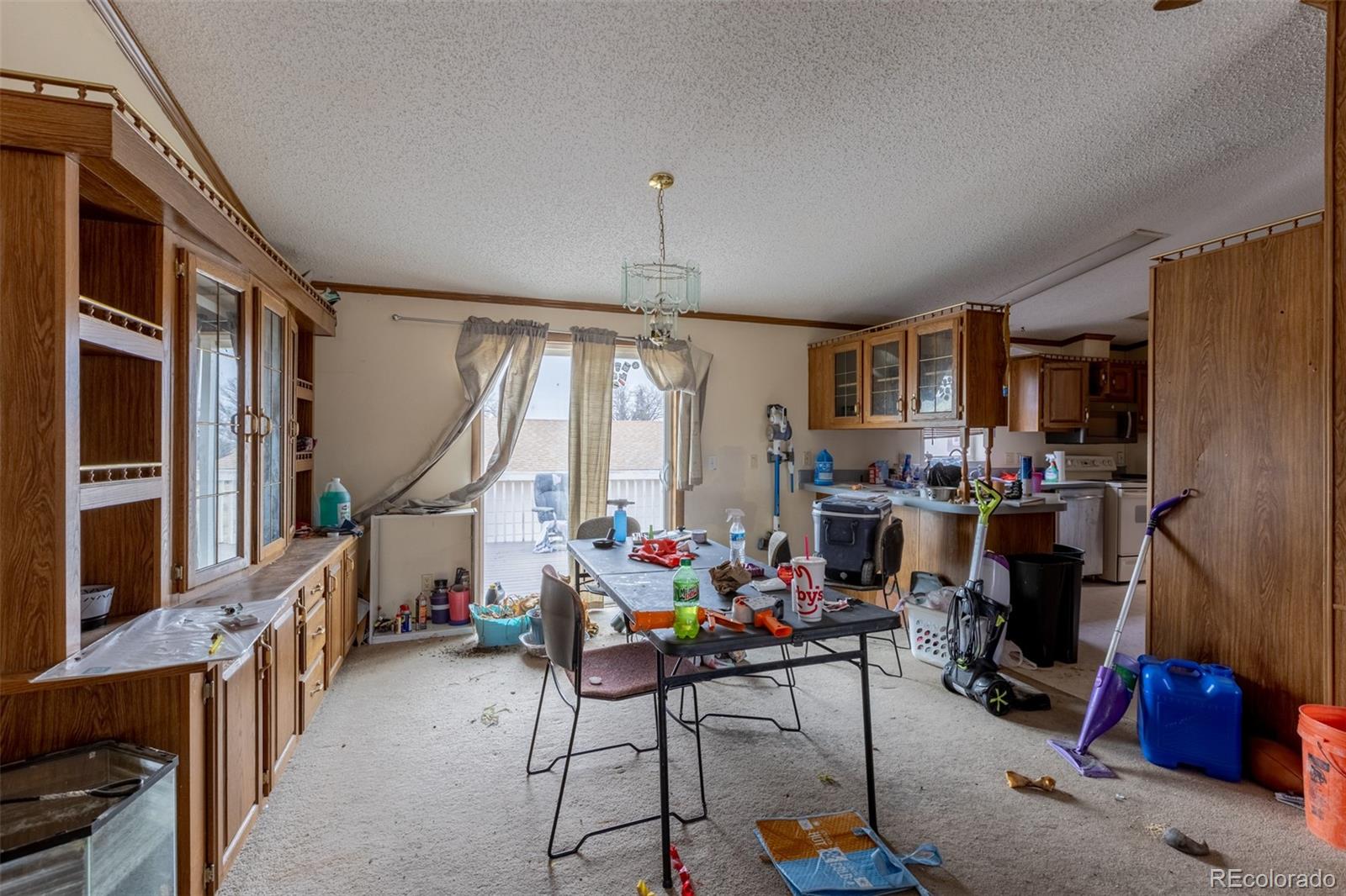 114 6th Street Hugo, CO 80821 - Photo 13 of 50 a very nice looking room with many windows and furniture