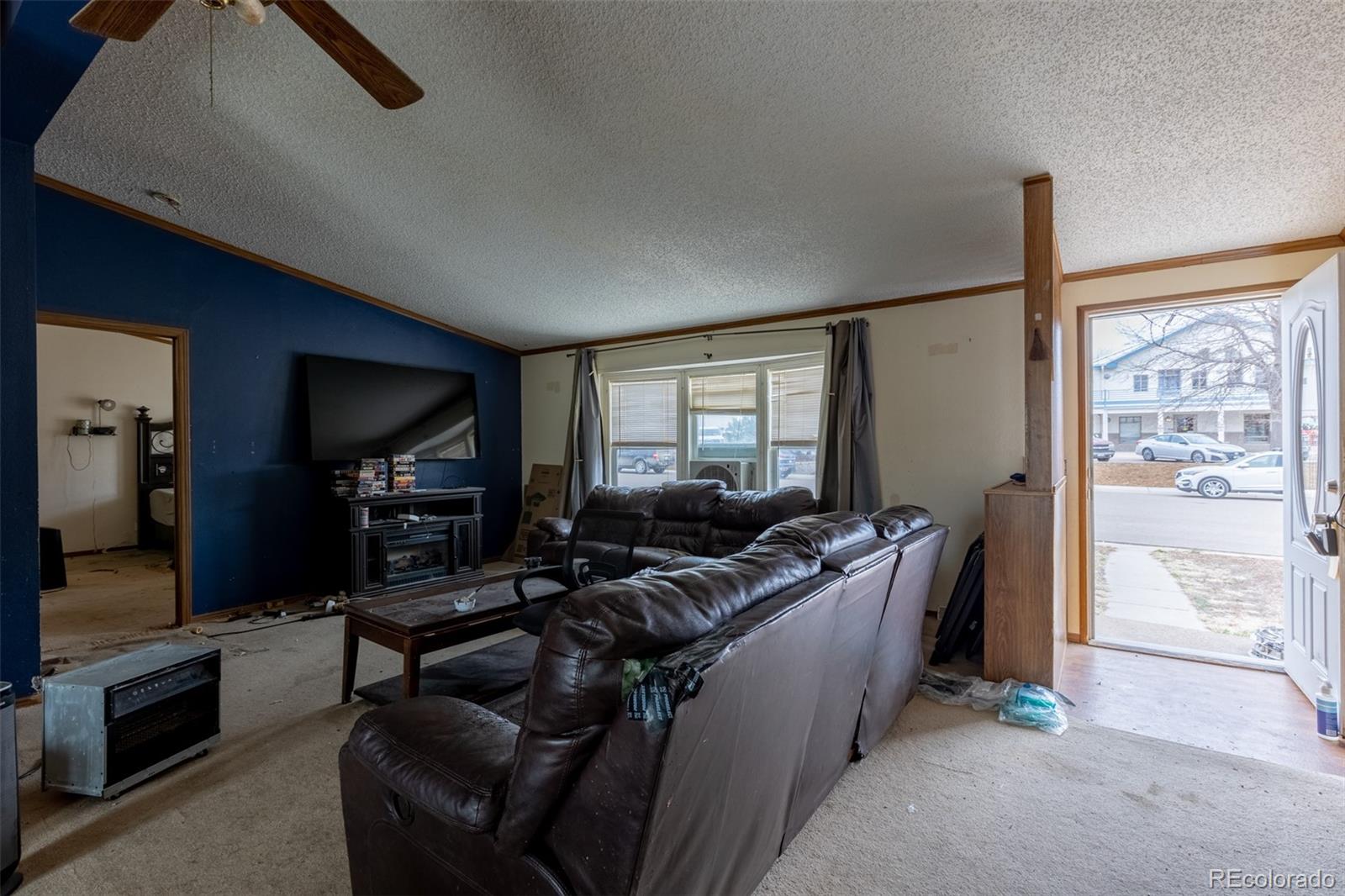 114 6th Street Hugo, CO 80821 - Photo 14 of 50 a living room with furniture and a flat screen tv