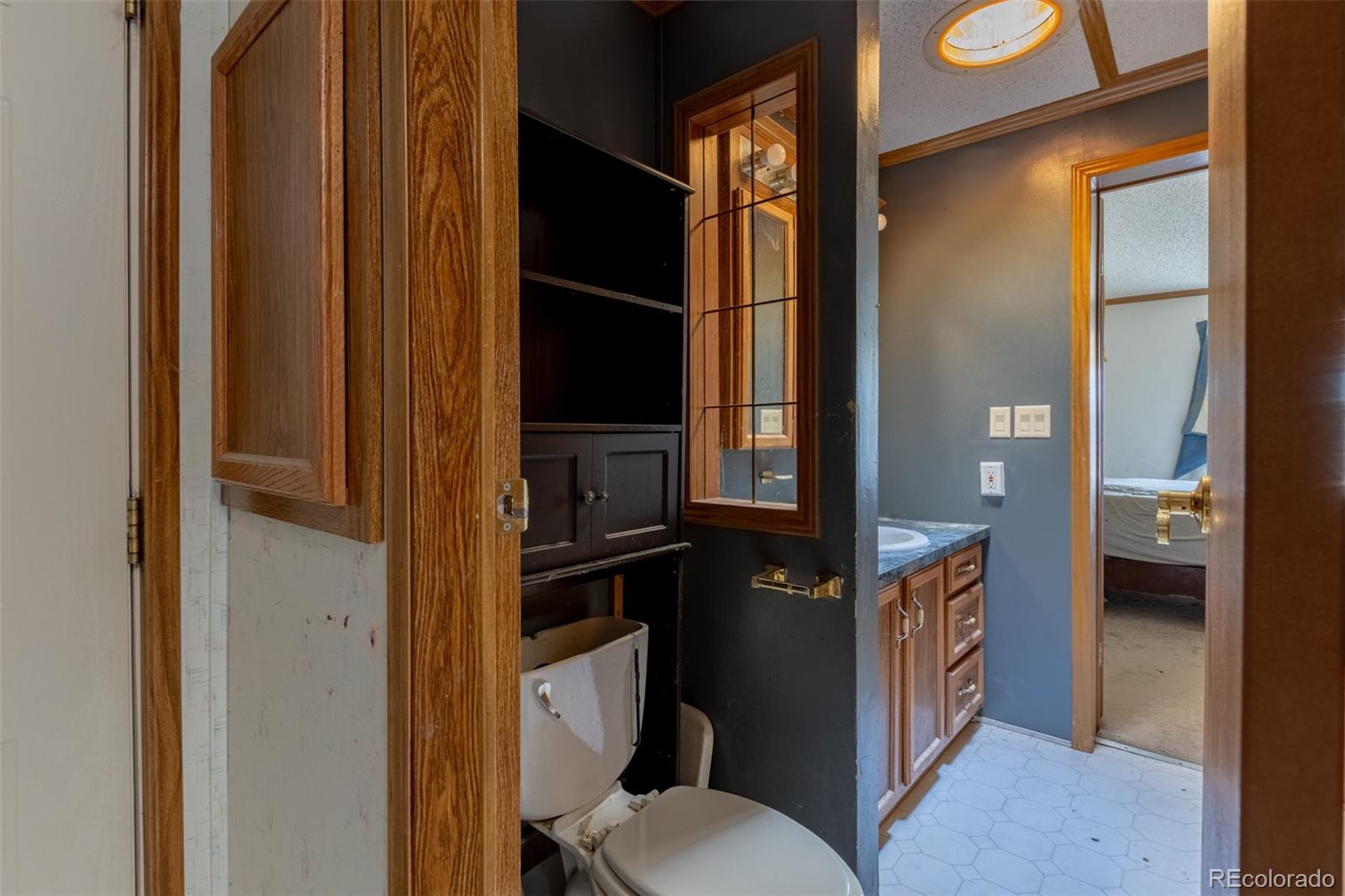 114 6th Street Hugo, CO 80821 - Photo 25 of 50 a bathroom with a toilet and a shower