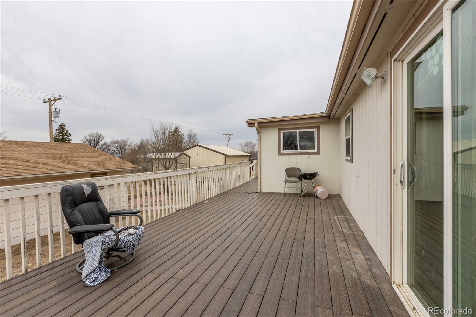 114 6th Street Hugo, CO 80821 - Photo 3 of 50 a view of livingroom with wooden floor and furniture