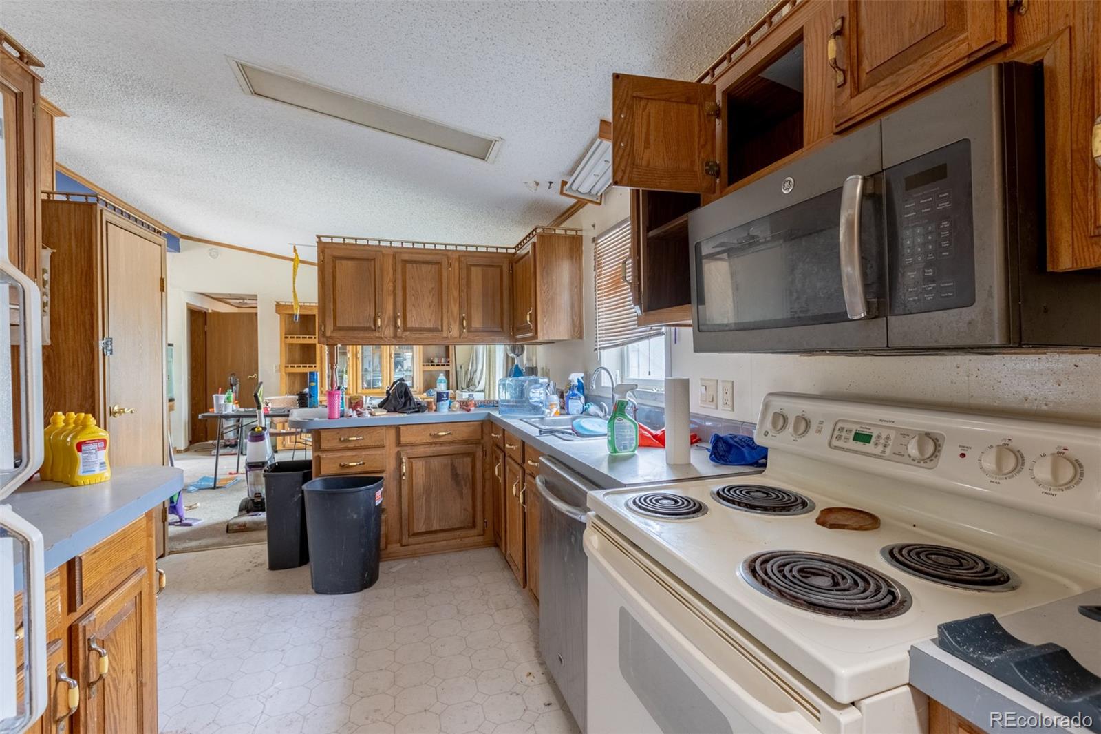 114 6th Street Hugo, CO 80821 - Photo 32 of 50 a kitchen with a stove and a sink