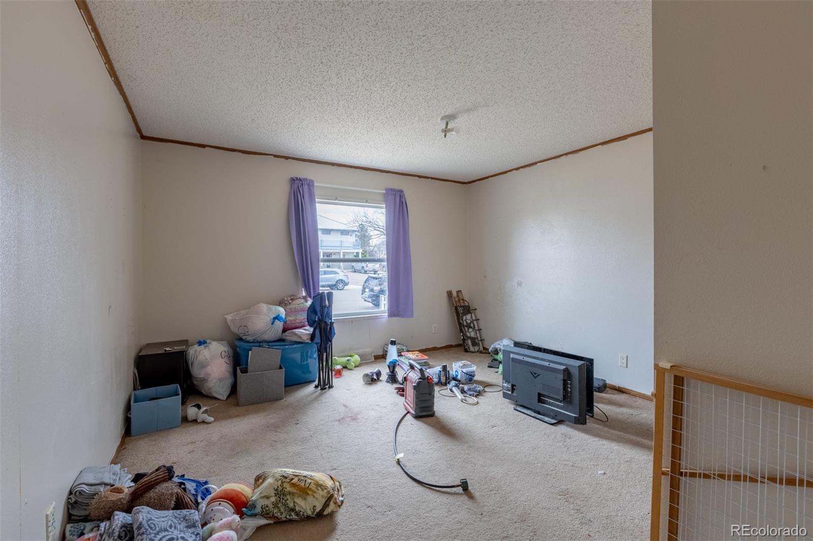 114 6th Street Hugo, CO 80821 - Photo 40 of 50 a living room with furniture and a window