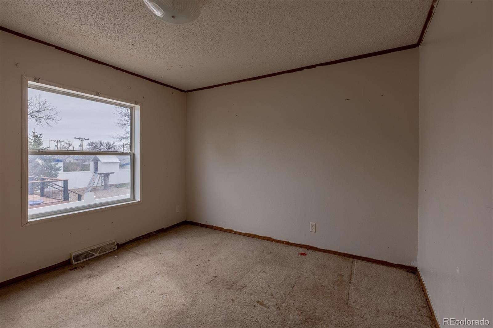 114 6th Street Hugo, CO 80821 - Photo 42 of 50 a view of an empty room with windows
