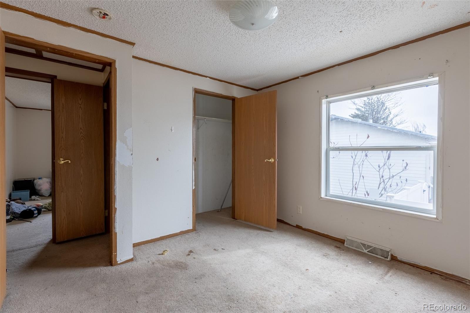 114 6th Street Hugo, CO 80821 - Photo 43 of 50 an empty room with windows and closet