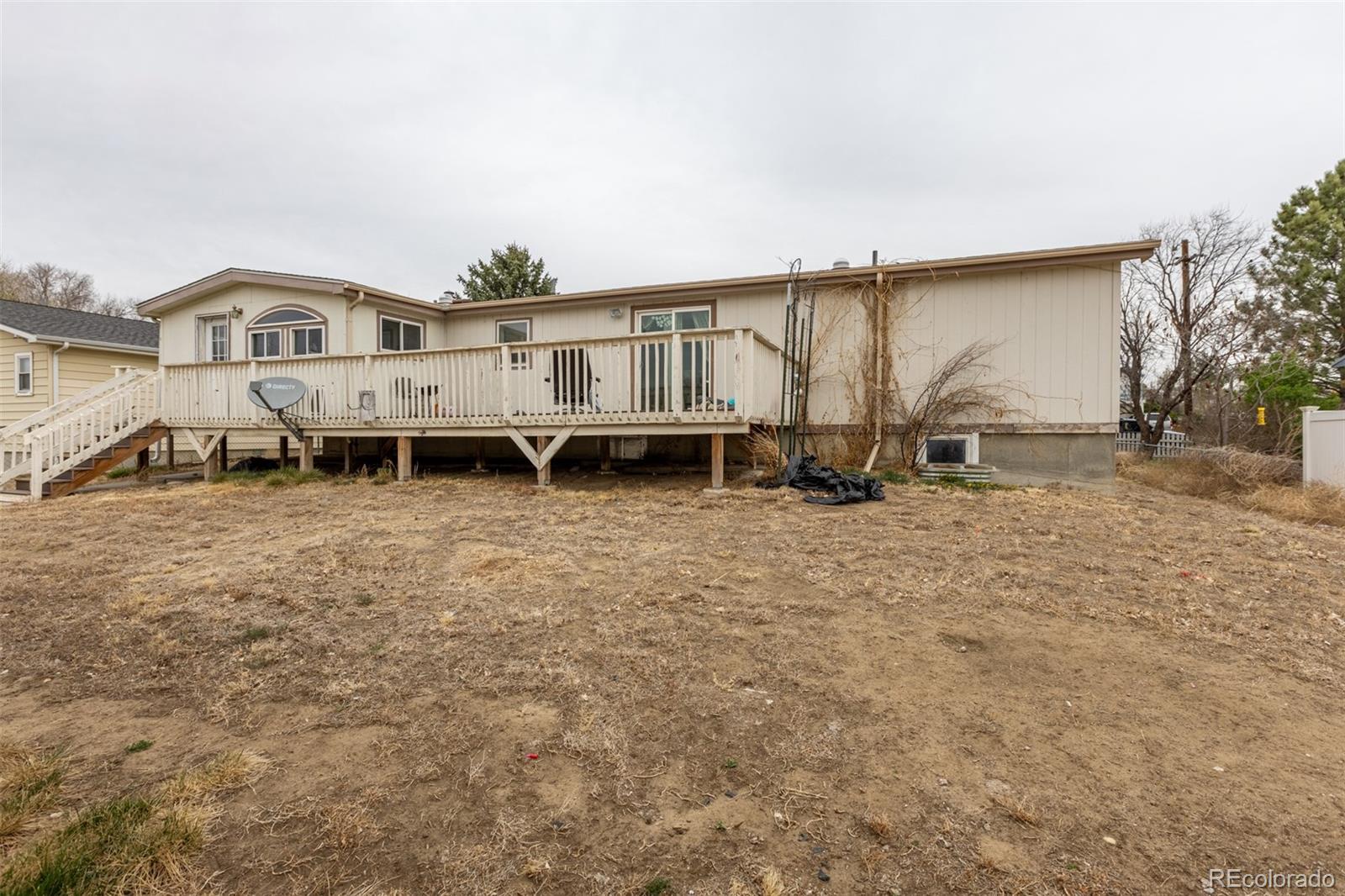 114 6th Street Hugo, CO 80821 - Photo 7 of 50 a front view of a house with a yard