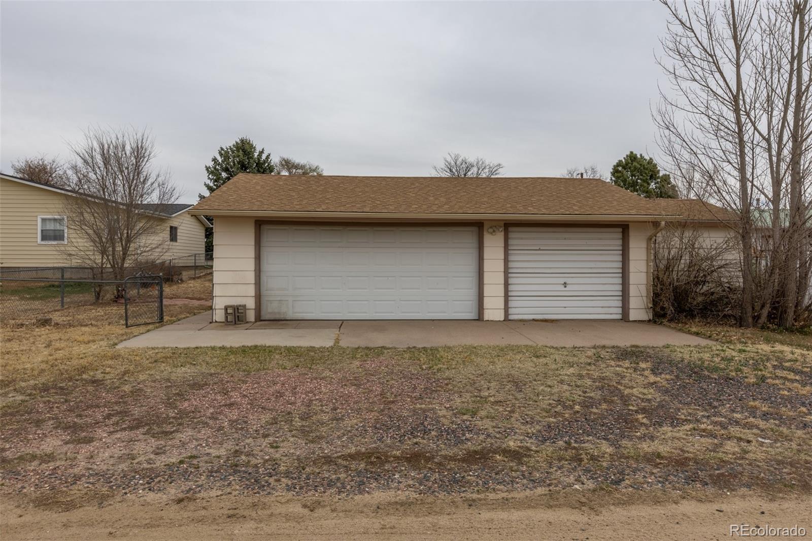 114 6th Street Hugo, CO 80821 - Photo 10 of 50 a front view of house with garage