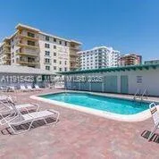 a view of pool with outdoor seating