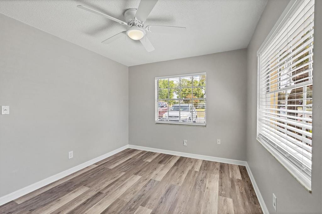 2403 Aspinwall Street Sarasota, FL 34237 - Photo 18 of 26 wooden floor in an empty room with a window
