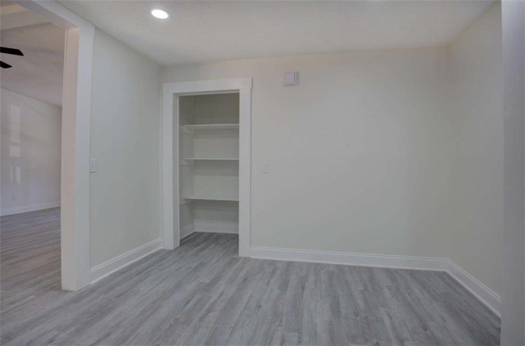390 Rocky Point Road Covington, GA 30014 - Photo 8 of 19 a view of an empty room with wooden floor