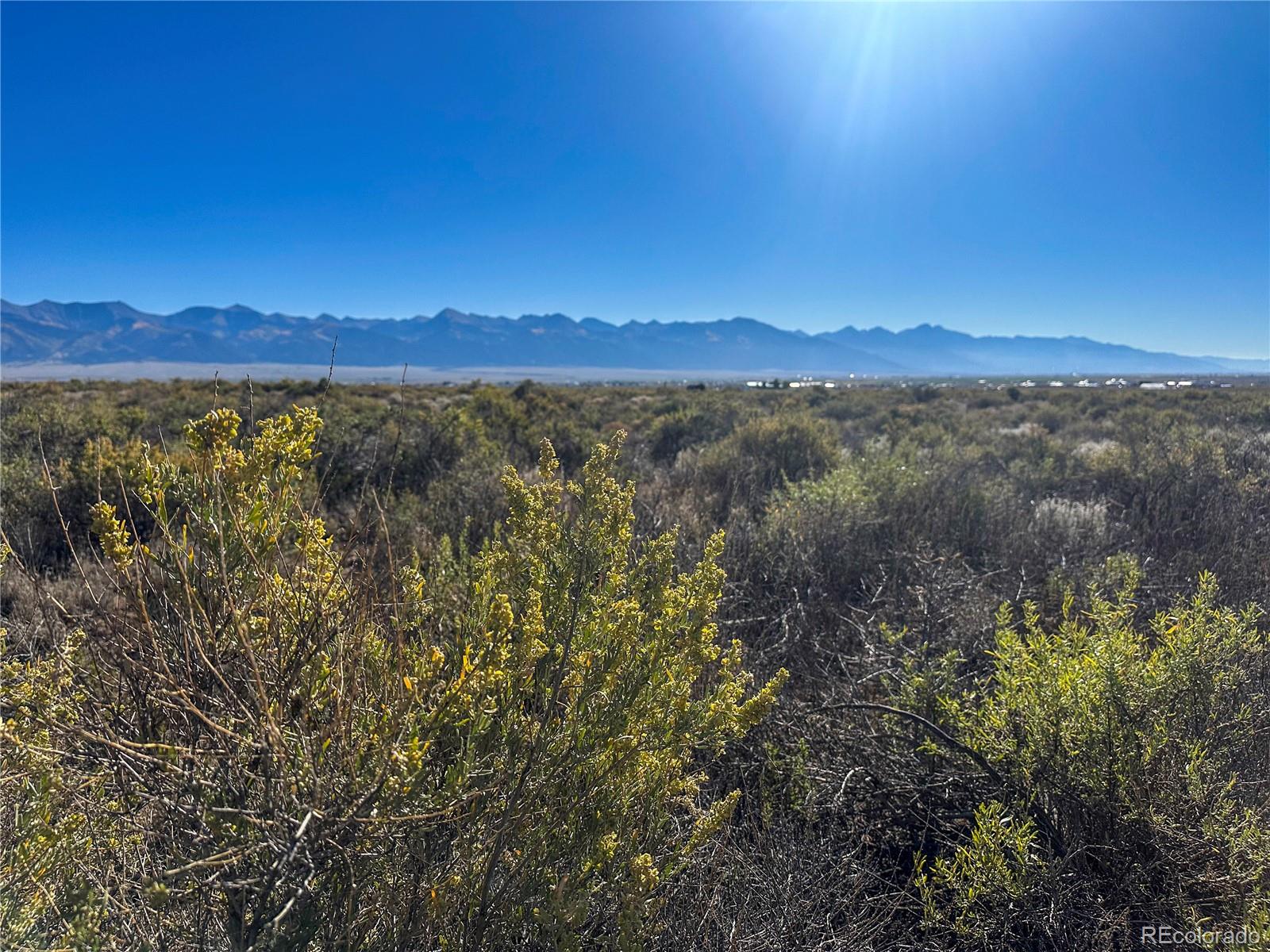 56501 Ewing Road Moffat, CO 81143 - Photo 20 of 28 a view of a city with lush green forest