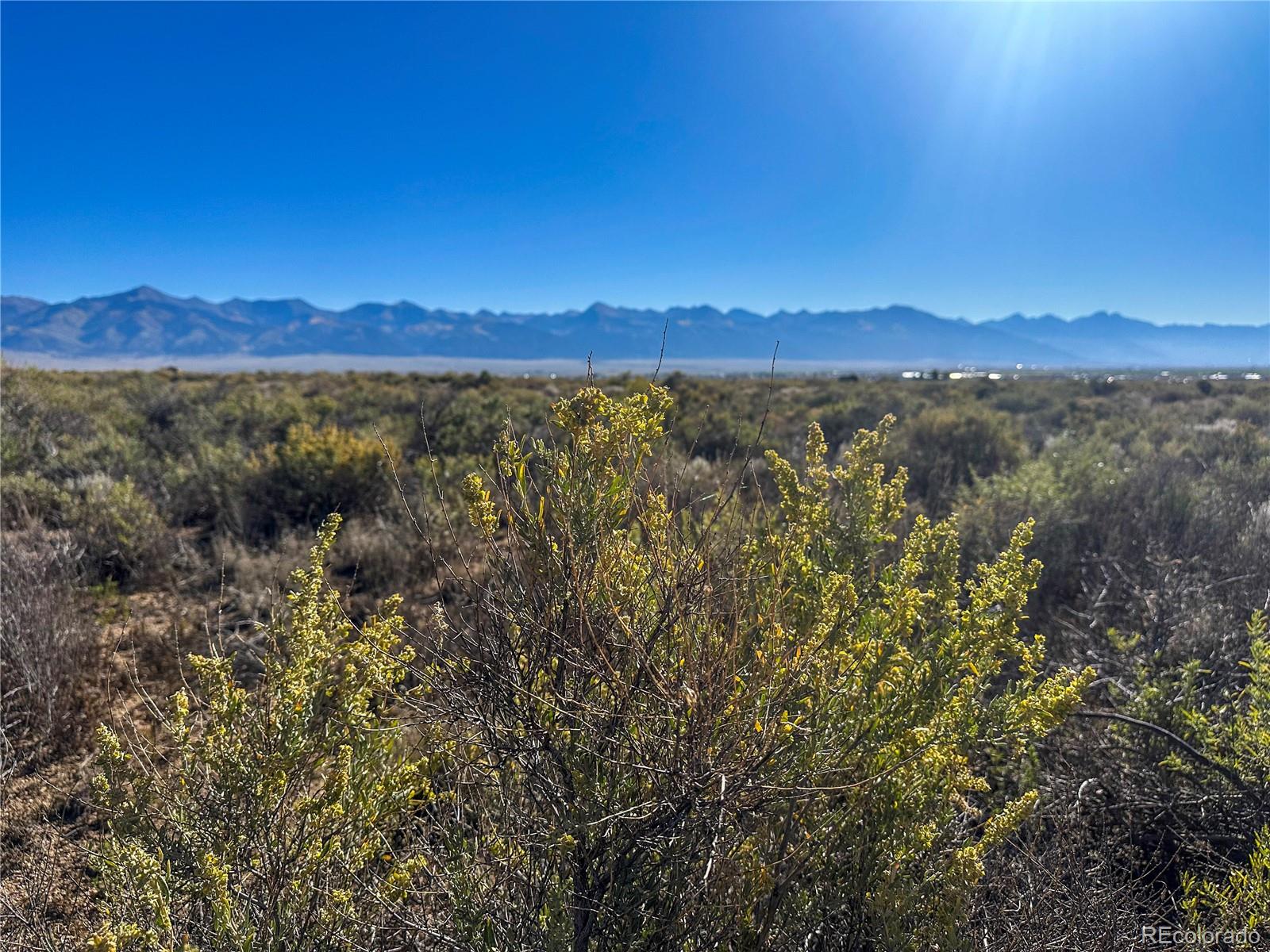 56501 Ewing Road Moffat, CO 81143 - Photo 21 of 28 a view of a city with lush green forest