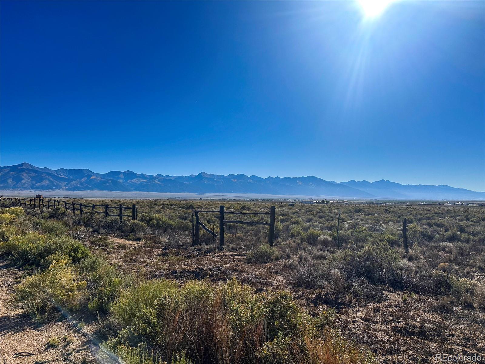 56501 Ewing Road Moffat, CO 81143 - Photo 27 of 28 a view of a lake with sunset