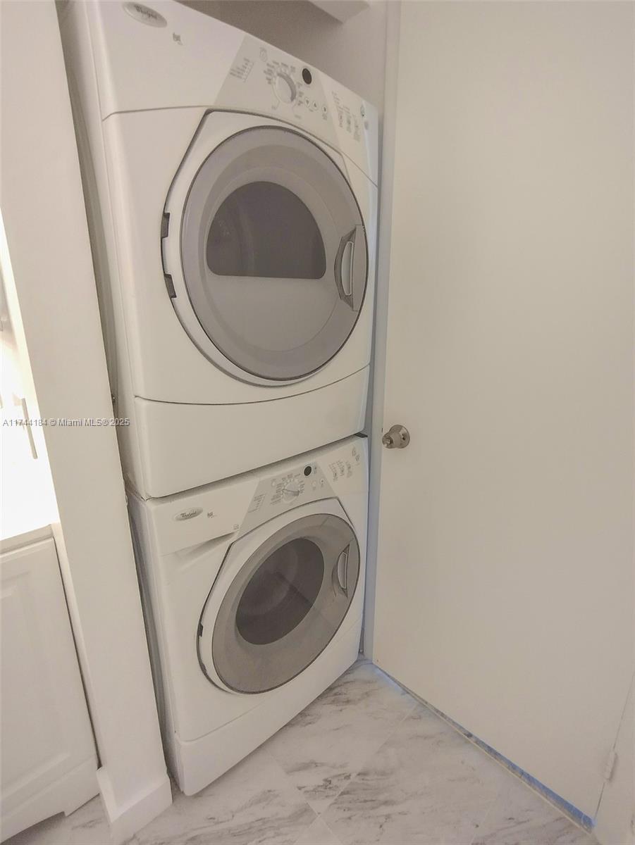 4174 Inverrary Drive, Unit 706 Lauderhill, FL 33319 - Photo 13 of 59 a utility room with dryer and washer