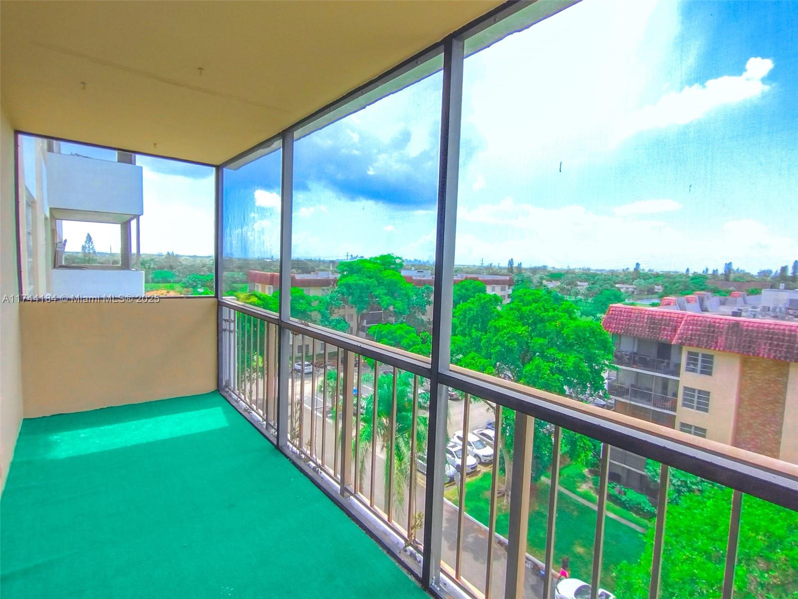 4174 Inverrary Drive, Unit 706 Lauderhill, FL 33319 - Photo 16 of 59 a view of a balcony with an outdoor space