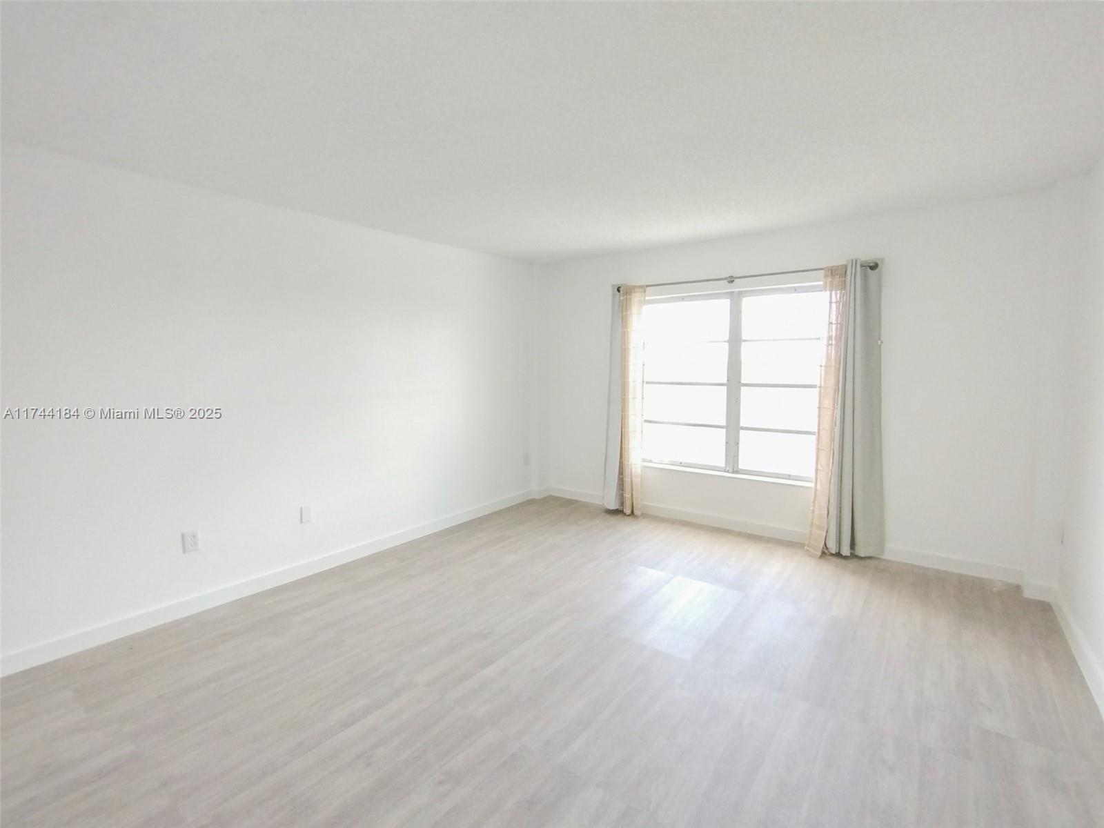 4174 Inverrary Drive, Unit 706 Lauderhill, FL 33319 - Photo 22 of 59 an empty room with windows