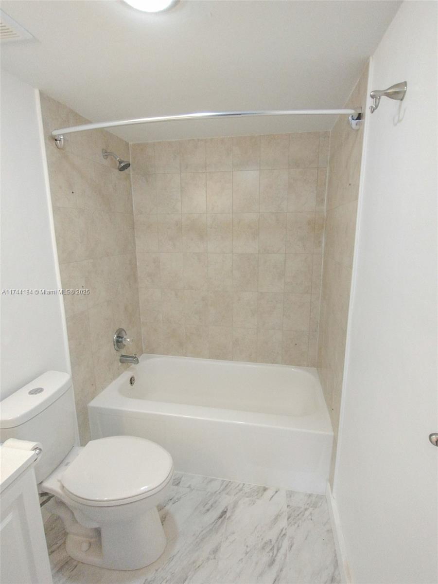 4174 Inverrary Drive, Unit 706 Lauderhill, FL 33319 - Photo 27 of 59 a bathroom with a toilet and a shower