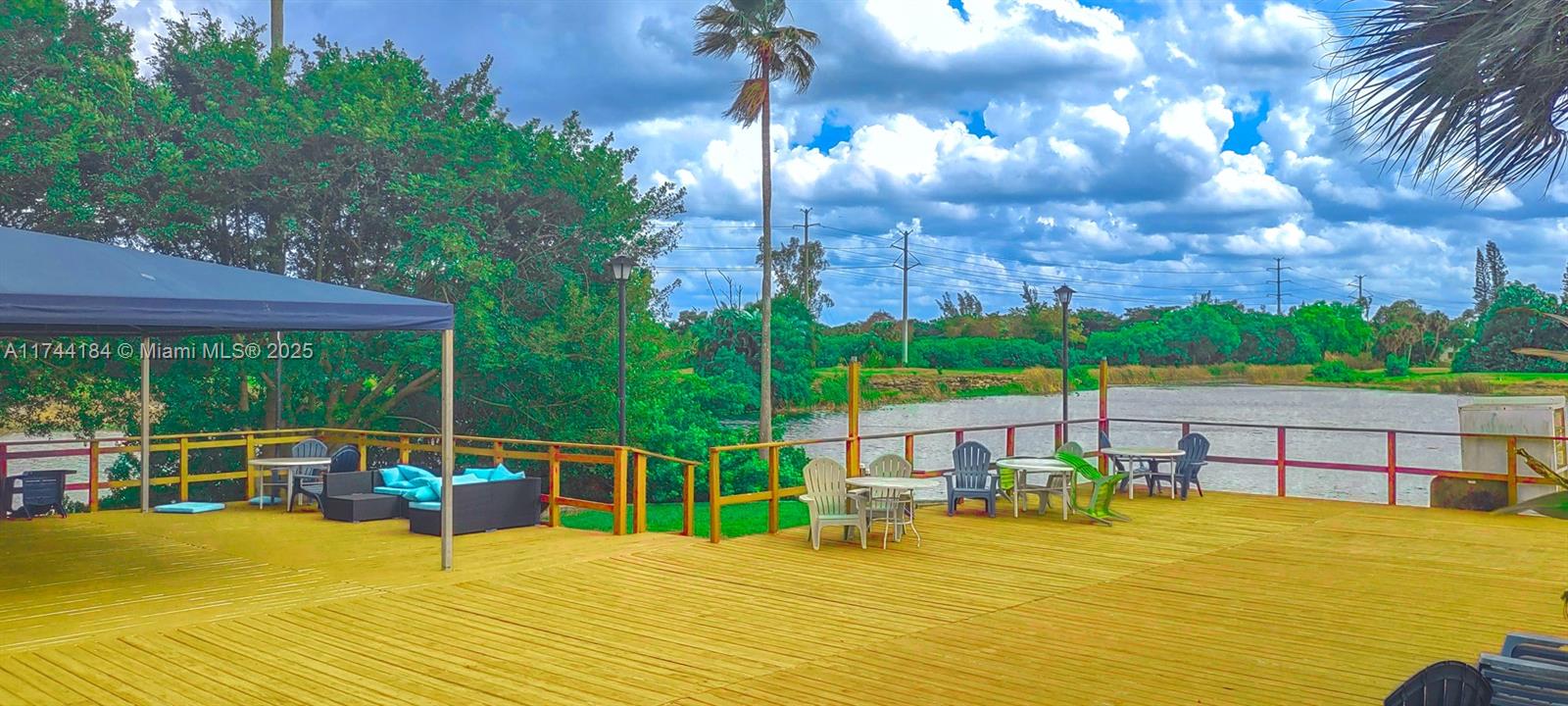 4174 Inverrary Drive, Unit 706 Lauderhill, FL 33319 - Photo 37 of 59 a view of a swimming pool with a patio and a garden