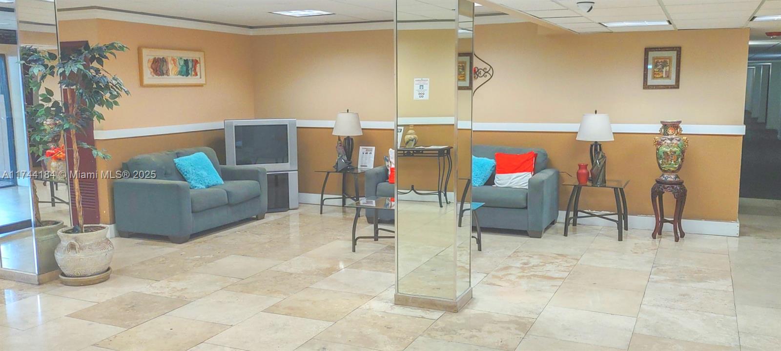 4174 Inverrary Drive, Unit 706 Lauderhill, FL 33319 - Photo 39 of 59 a living room with furniture and white walls