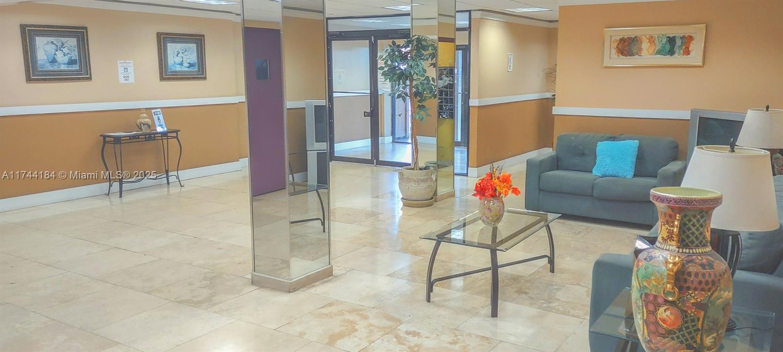 4174 Inverrary Drive, Unit 706 Lauderhill, FL 33319 - Photo 40 of 59 a living room with furniture and a rug