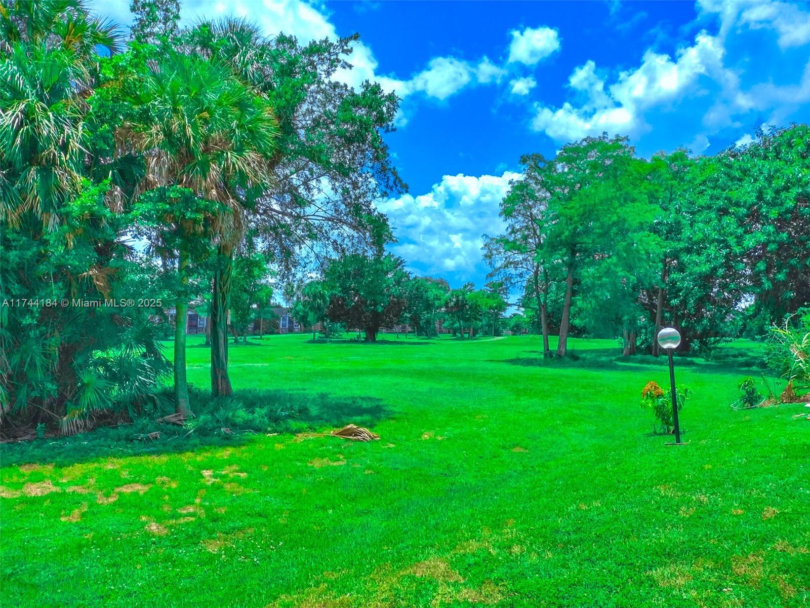 4174 Inverrary Drive, Unit 706 Lauderhill, FL 33319 - Photo 44 of 59 a view of a backyard with green space