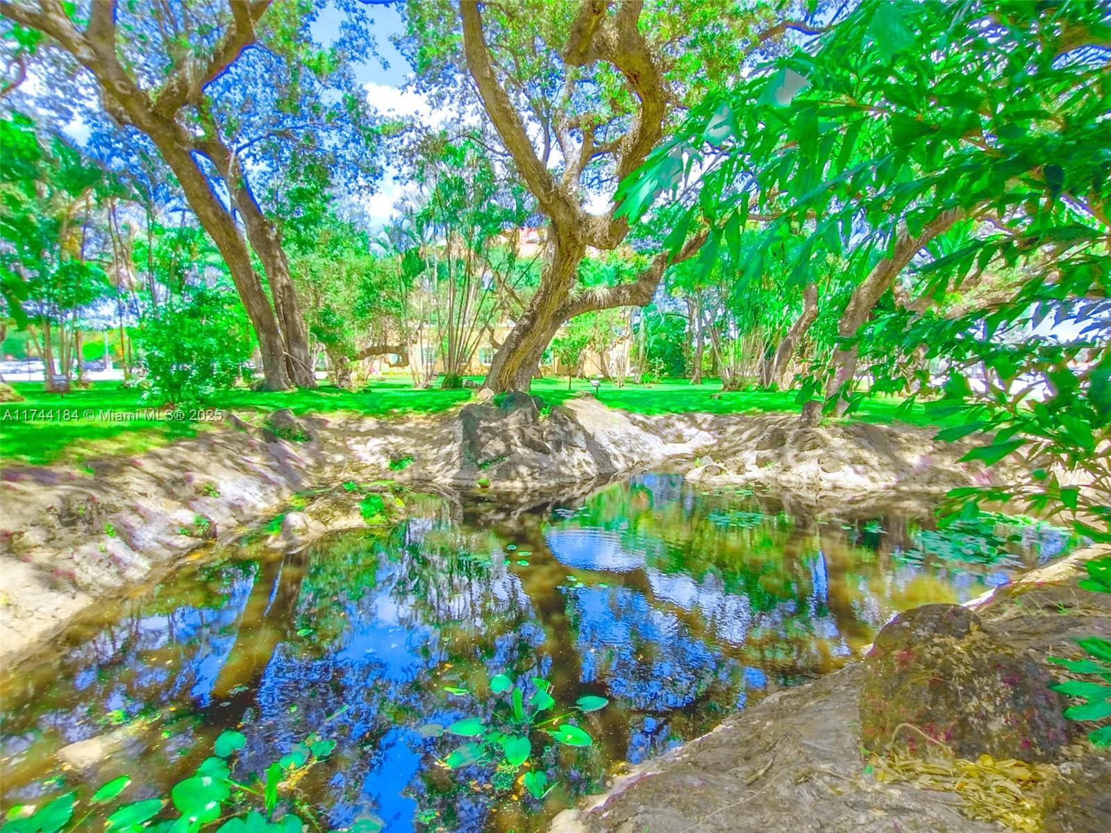 4174 Inverrary Drive, Unit 706 Lauderhill, FL 33319 - Photo 49 of 59 a backyard of a house with lots of green space