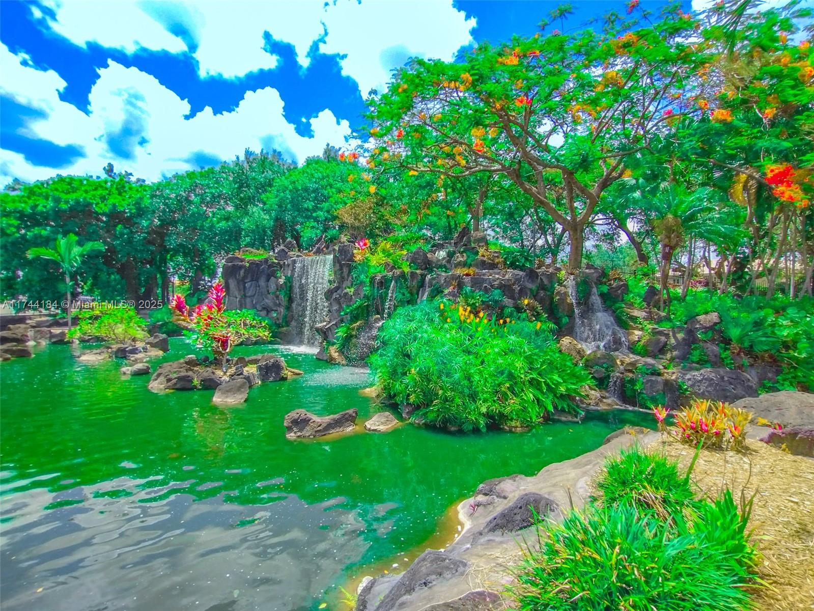 4174 Inverrary Drive, Unit 706 Lauderhill, FL 33319 - Photo 51 of 59 a green field with lots of flowers in it