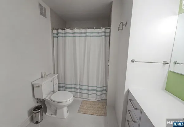a bathroom with a toilet and a sink