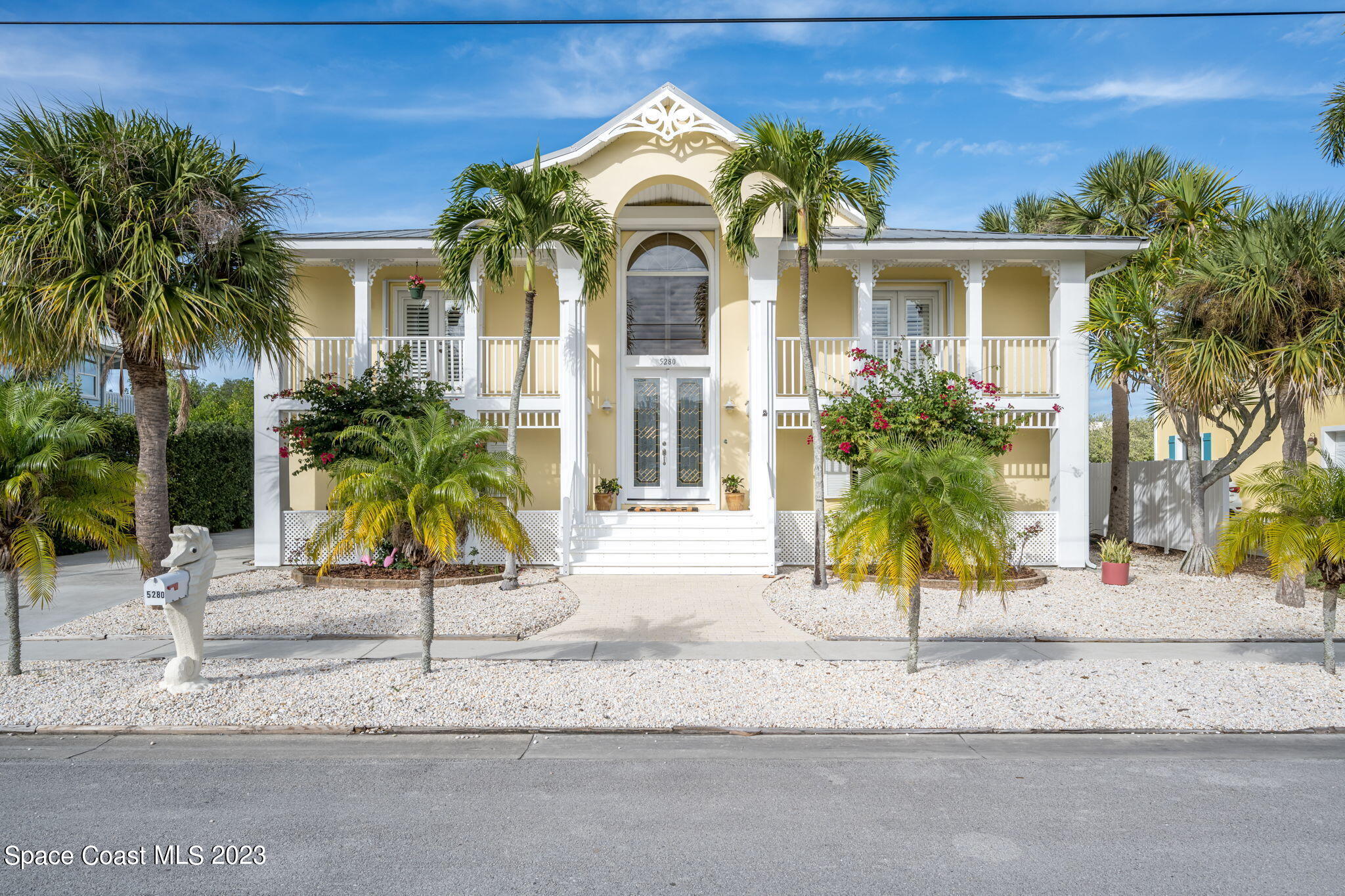 5280 95th Street Sebastian, FL 32958 - Photo 1 of 42 a view of a house with a small yard and palm trees