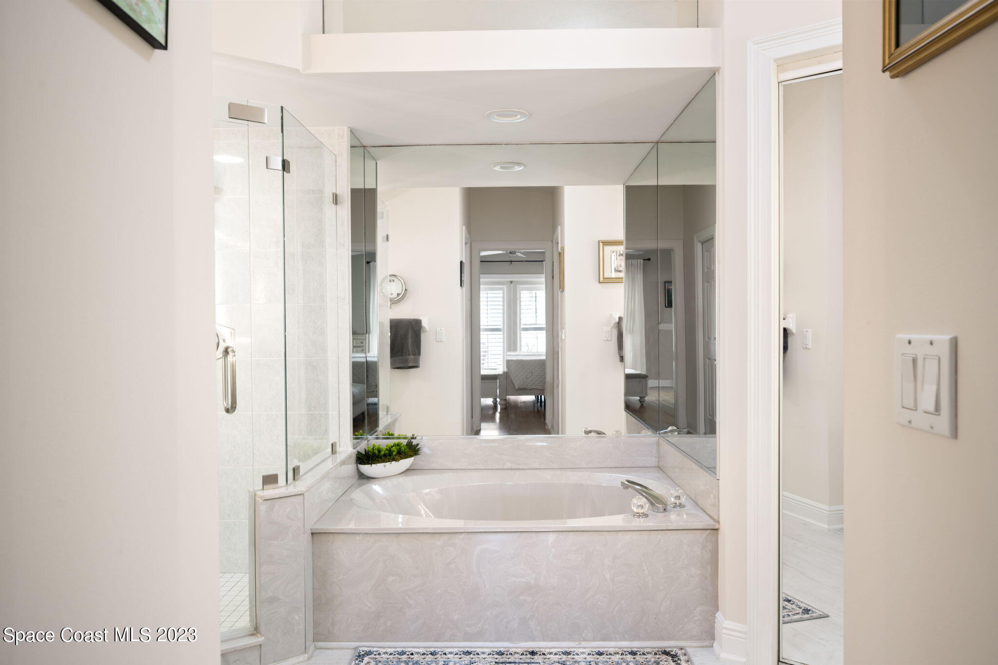 5280 95th Street Sebastian, FL 32958 - Photo 19 of 42 a bathroom with a bathtub and a shower