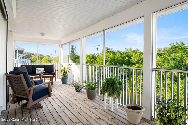 a view of a balcony with furniture